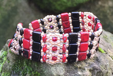 Load image into Gallery viewer, This lovely and intricately beaded Brocade bracelet of Red, Black and matte gold measures approximately 6 1/4" and closes with a magnetic clasp. Glass beads include Czech Fire-polished crystals, Czech glass tile, Superduos and glass seed beads. Another option: matching additional thinner bracelet for $20 more.