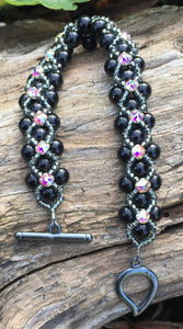 This striking Black glass Pearl and Dark Gray Seed Bead Montee bracelet measures 7 1/8".