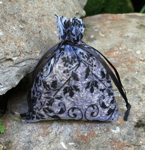 This Black and Silver Damask style Organza Lavender Sachet is useful in diminishing stress, easily fits in a drawer, purse, gym bag, or locker and makes a unique gift. The contents of each sachet is Oregon lavender, and only lavender, thus there are no other fillers. Lavender has plenty of its own natural oils, so give it a gentle squeeze to slightly bruise the buds to draw out more fragrance. This sachet should not be heated or put into a microwave oven.