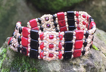 Load image into Gallery viewer, This lovely and intricately beaded Brocade bracelet of Red, Black and matte gold measures approximately 6 1/4&quot; and closes with a magnetic clasp. Glass beads include Czech Fire-polished crystals, Czech glass tile, Superduos and glass seed beads. Another option: matching additional thinner bracelet for $20 more.
