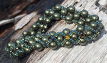 Load image into Gallery viewer, Dark and sparkly, this Dark Olive glass pearl bracelet is entwined with Capri Blue seed beads and rich warm Swarovski Golden Tabac Crystal Montees. This bracelet has a magnetic closure and measures 7 3/8&quot;.