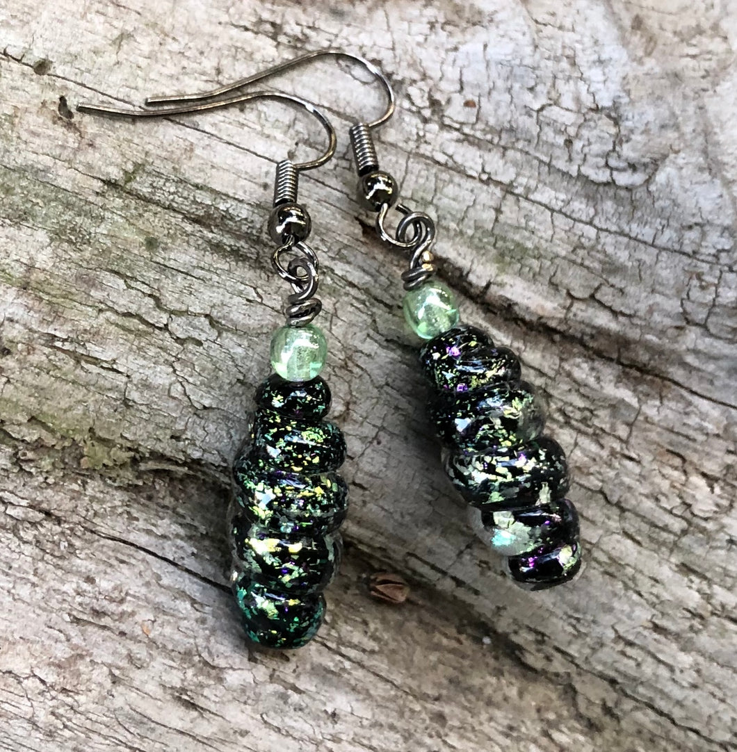 These shimmering black and light green Dichroic earrings measure1 1/2