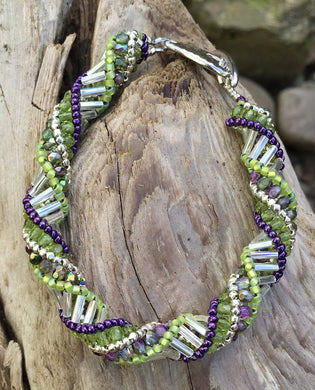 This trendy and intricately beaded Helix Bracelet measures between 8 - 8 1/4