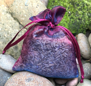 This Burgundy Navy Shimmer Lavender Sachet is useful in diminishing stress, easily fits in a drawer, purse, gym bag, or locker and makes a unique gift. The contents of each sachet is Oregon lavender, and only lavender, thus there are no other fillers. Lavender has plenty of its own natural oils, so give it a gentle squeeze to slightly bruise the buds to draw out more fragrance. This sachet should not be heated or put into a microwave oven.