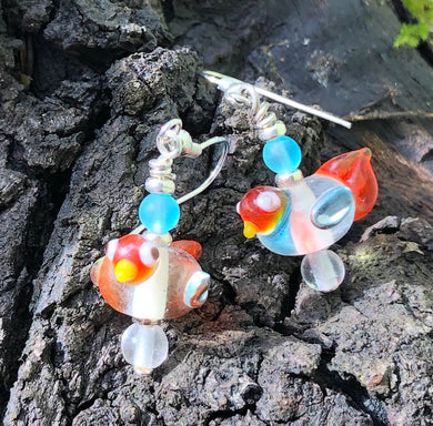 These sweet and tiny clear and orange lampwork glass birds dangles measure 3/4