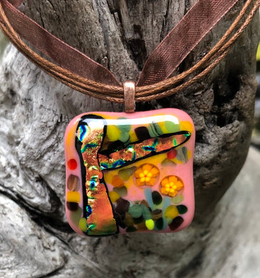 Autumn Forest includes Dichroic and Murrine, the pendant measuring 1 1/4” x 1 1/4”, and is completed with a fall brown organza cord, adjustable from 16 1/2” to 18”.