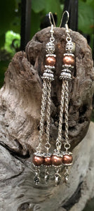 Dangling almost 5”, these Silver and Copper bouncy tassel earrings make quite a statement!!